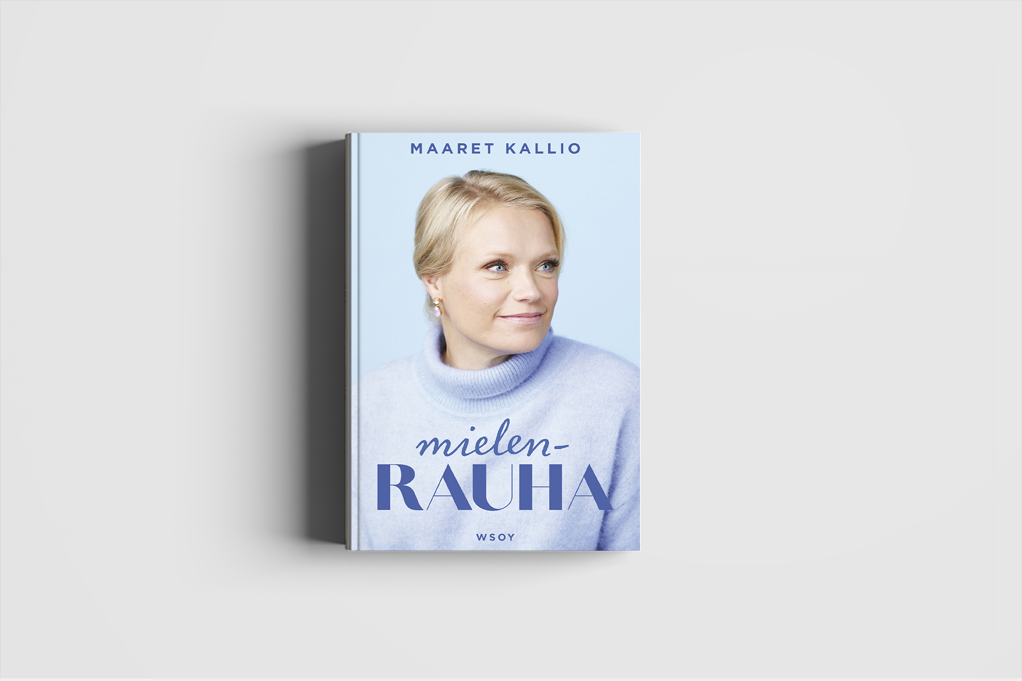 Kirja, jonka kansikuva esittää naista, jolla on vaaleat hiukset ja sininen pusero, ja teksti 'Mielenrauha' ja 'Maaret Kallio' kutakin kannen yläreunassa.