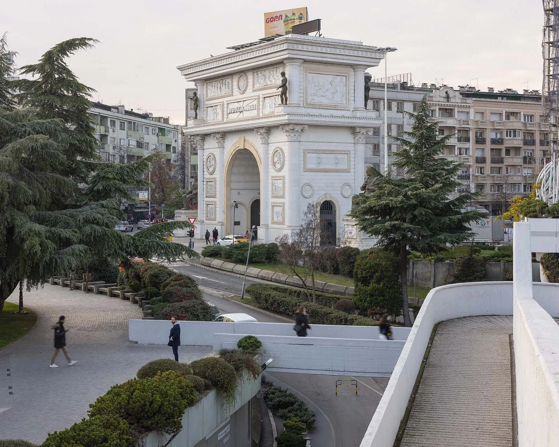 ocumentary photography by Roman Bezjak from the Skopje series: The post-1963 modernist reconstruction reshaped by the neoclassical Skopje 2014 project., and Porta Macedonia in the Background