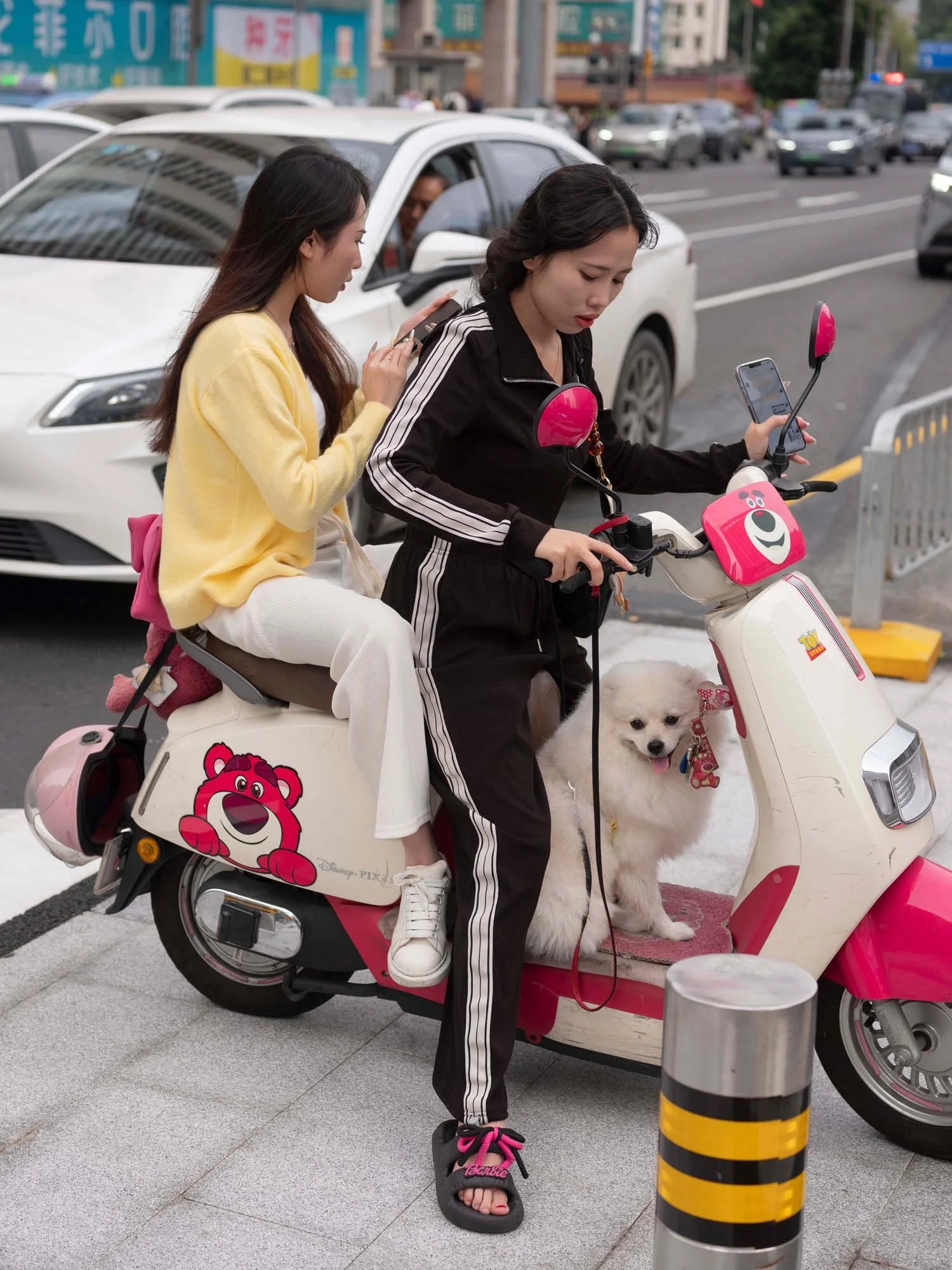 Documentary photograph by Roman Bezjak highlighting Shenzhen as a global leader in e-mobility, showing residents, families, and delivery workers navigating the city on electric scooters.