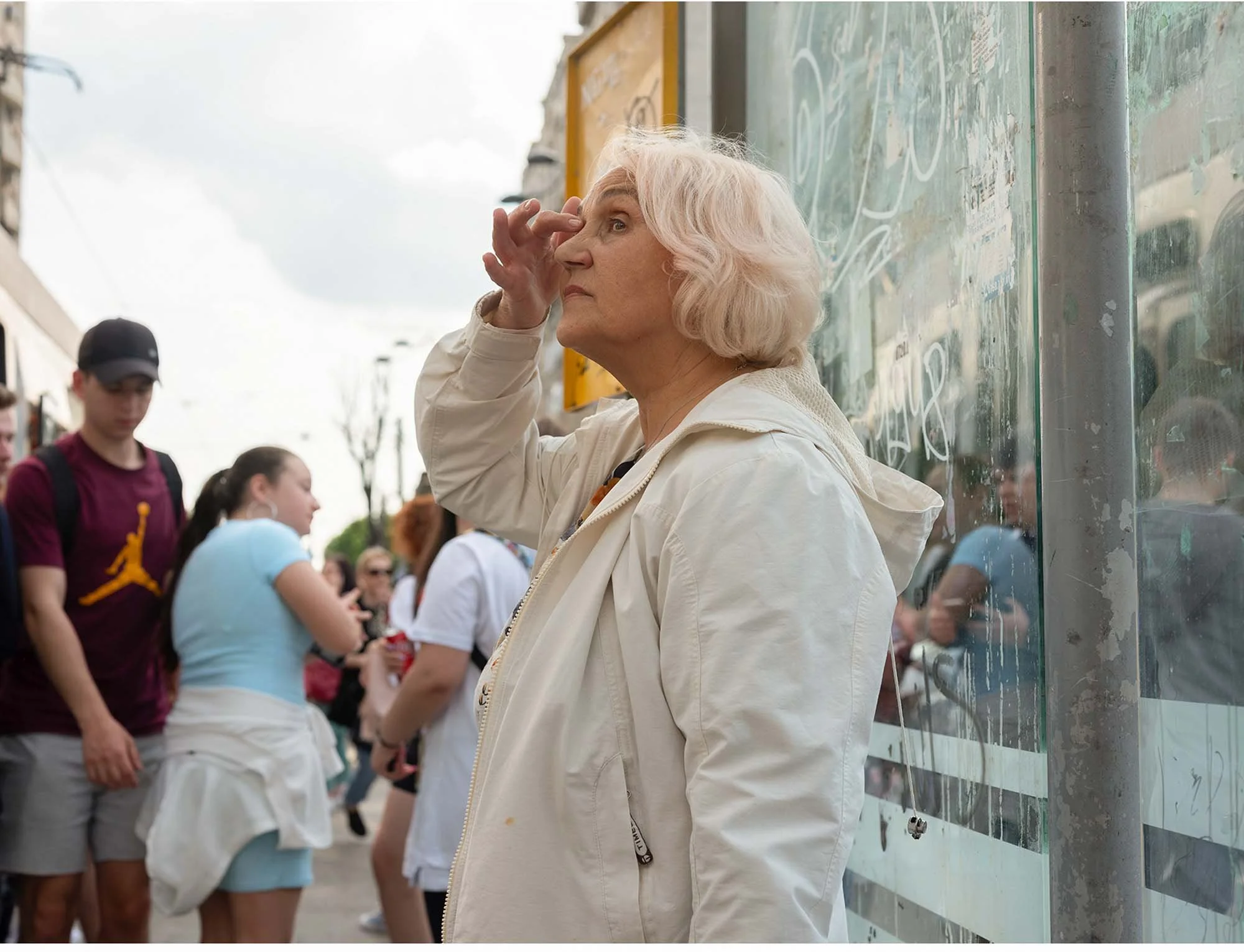 Documentary photo by Roman Bezjak from the series "Bucharest Tram," showing commuters waiting at Piața Unirii