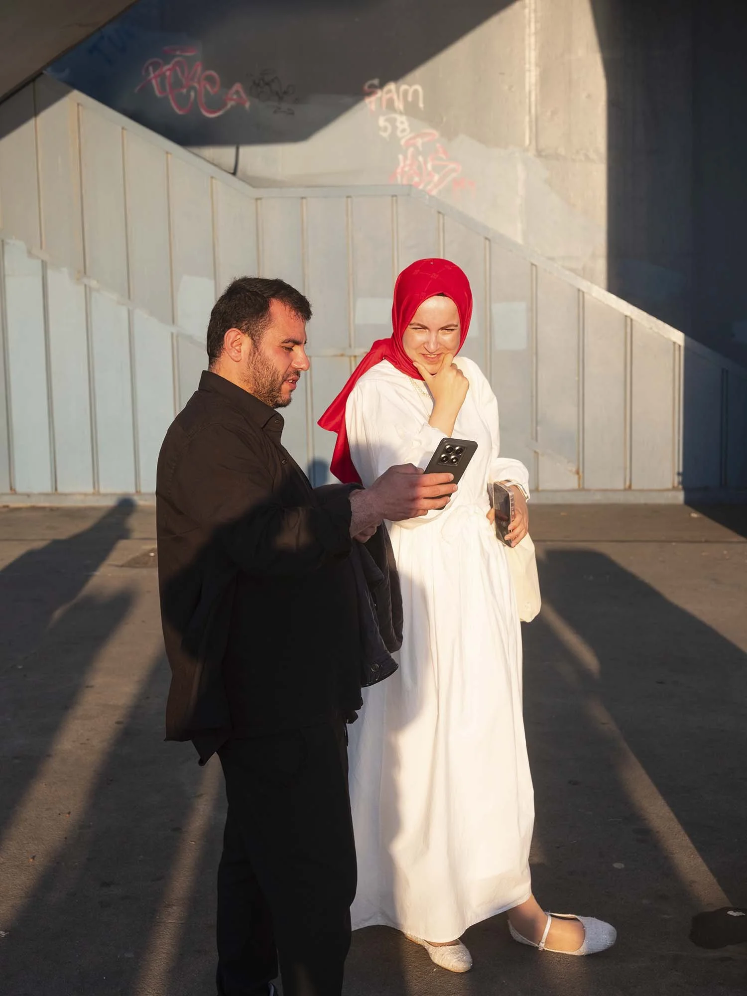 Bridemaids under the Galata Bridge in Istanbul captured in a documentary photography style by Roman Bezjak