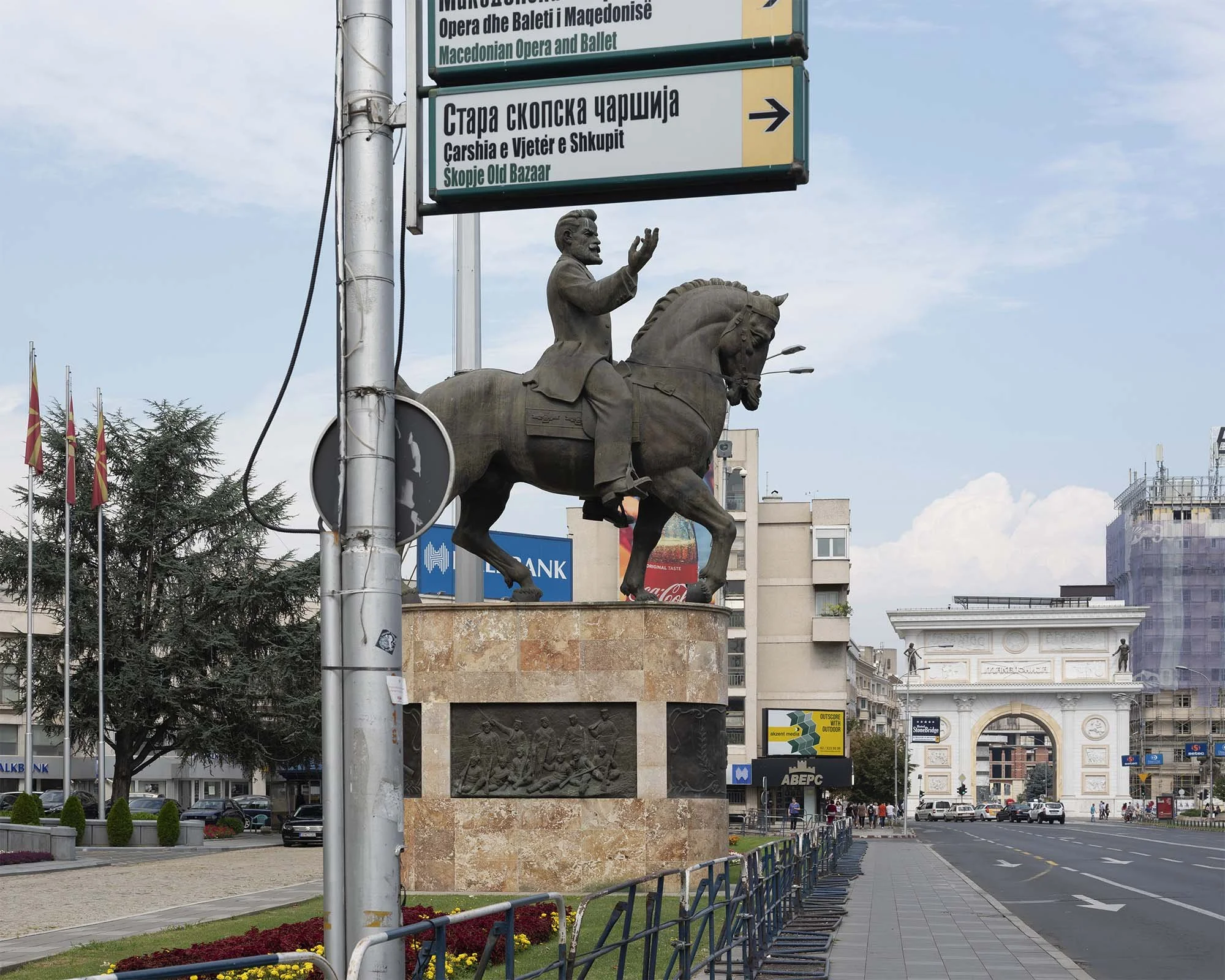 Documentary photography by Roman Bezjak from the Skopje series: The post-1963 modernist reconstruction reshaped by the neoclassical Skopje 2014 project.Equestrian Statue of Nikola Karev with the Porta Macedonia in the Background