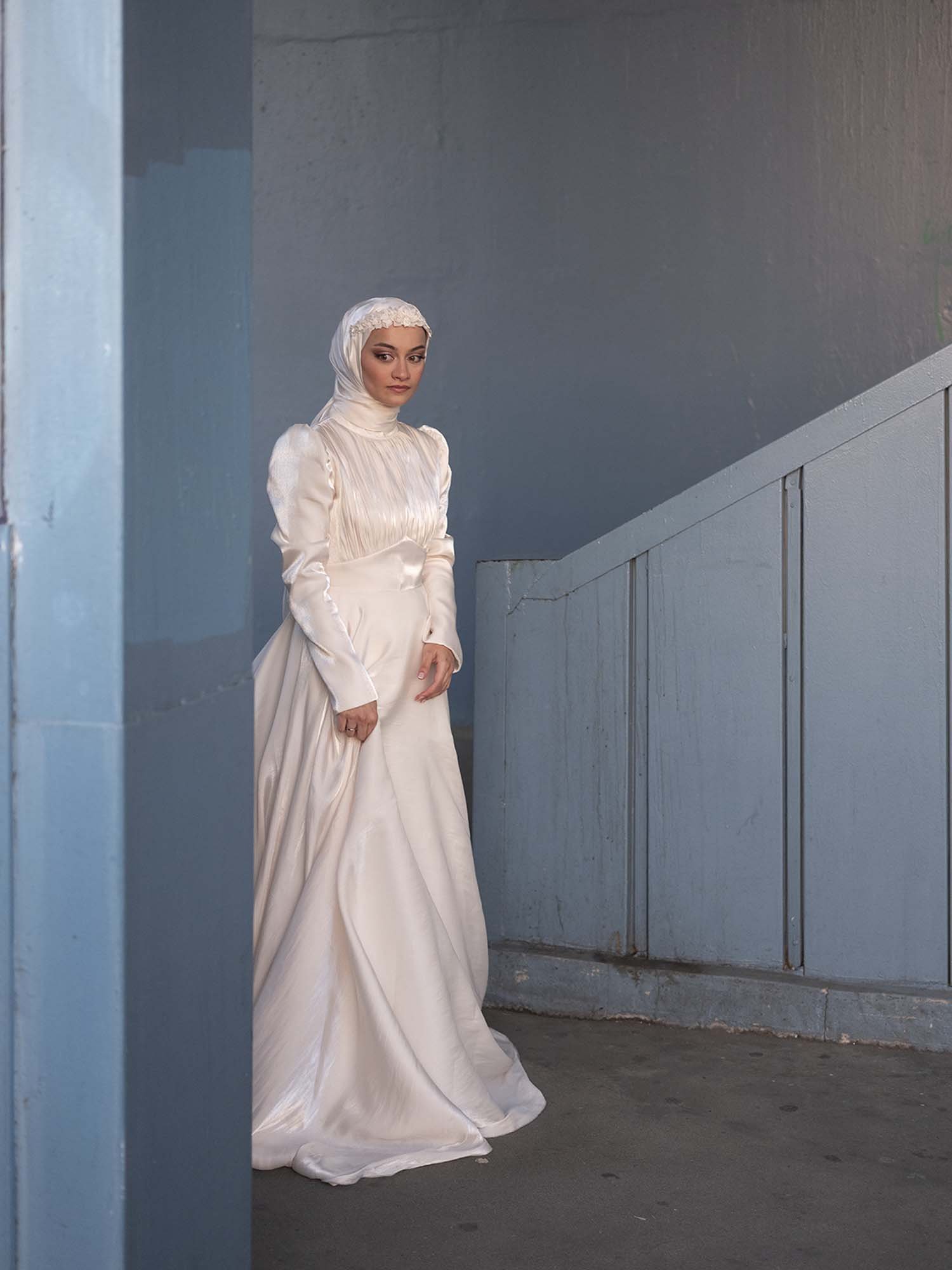 A newlywed bride  under the Galata Bridge in Istanbul captured in a documentary photography style by Roman Bezjak