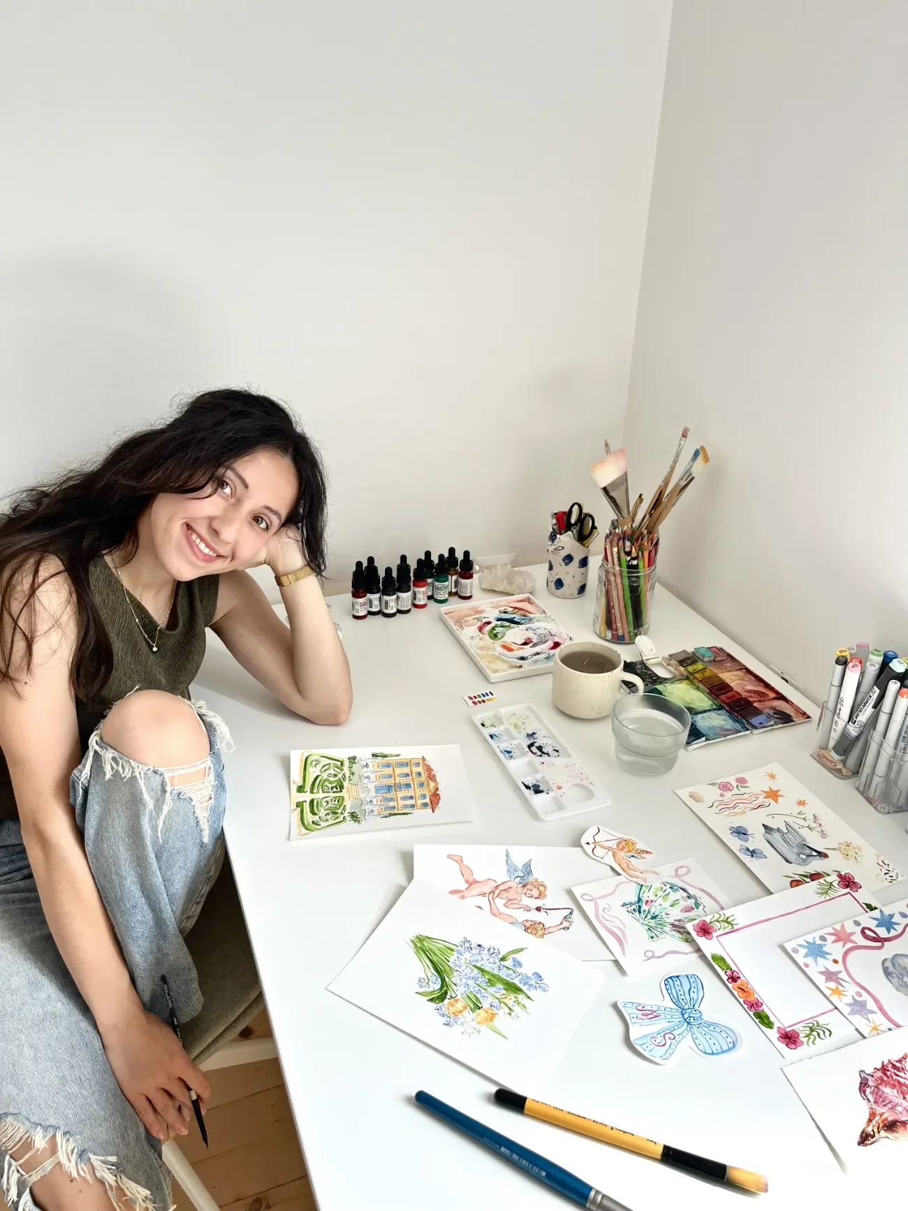 Portrait of watercolor wedding stationery artist Vanya Halsey in her art studio.