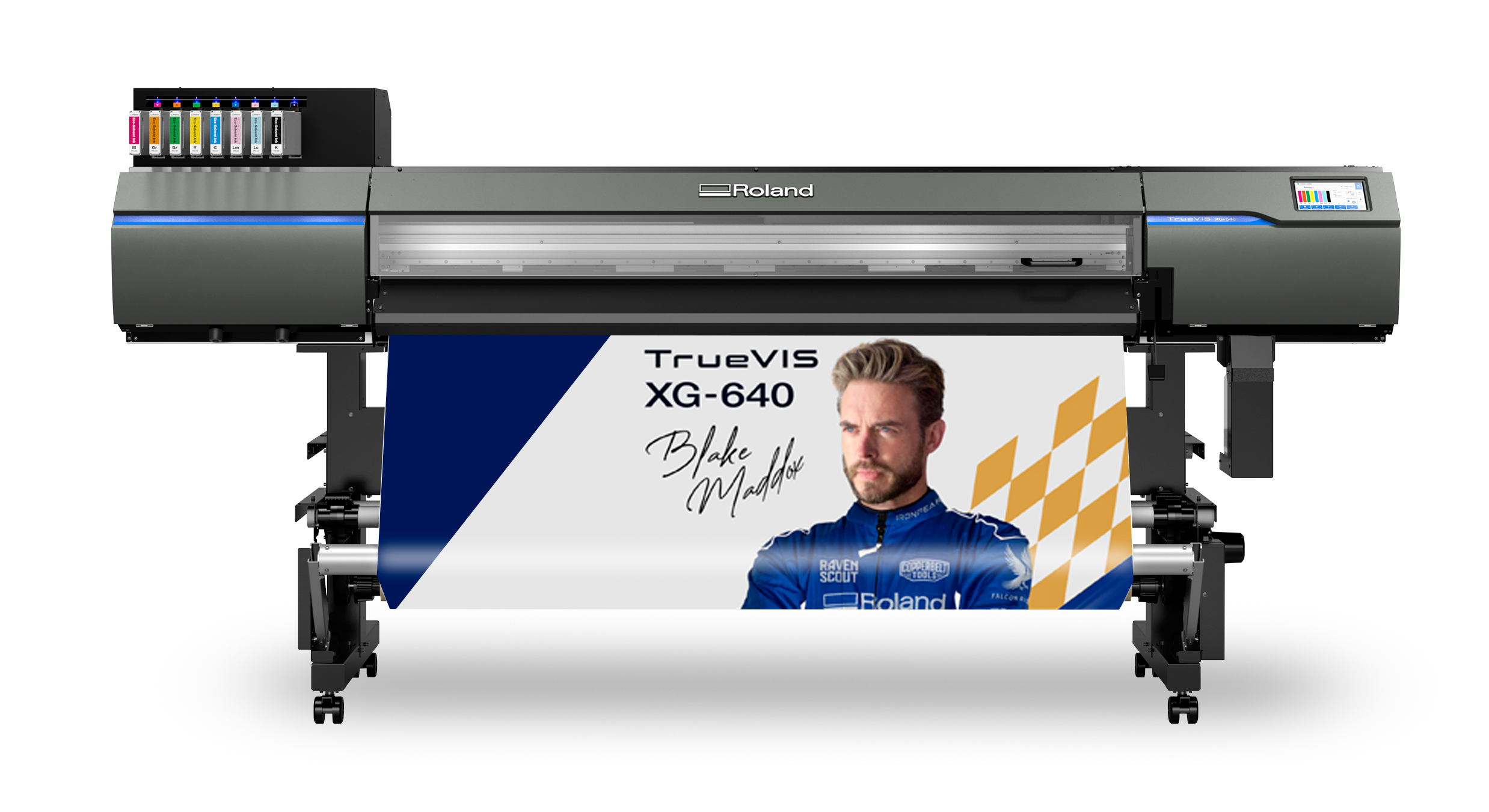 Large Roland VersaST XG-640 printer printing a banner featuring a man in a blue racing suit with the text 'TrueVIS XG-640 Blake Madoff'.
