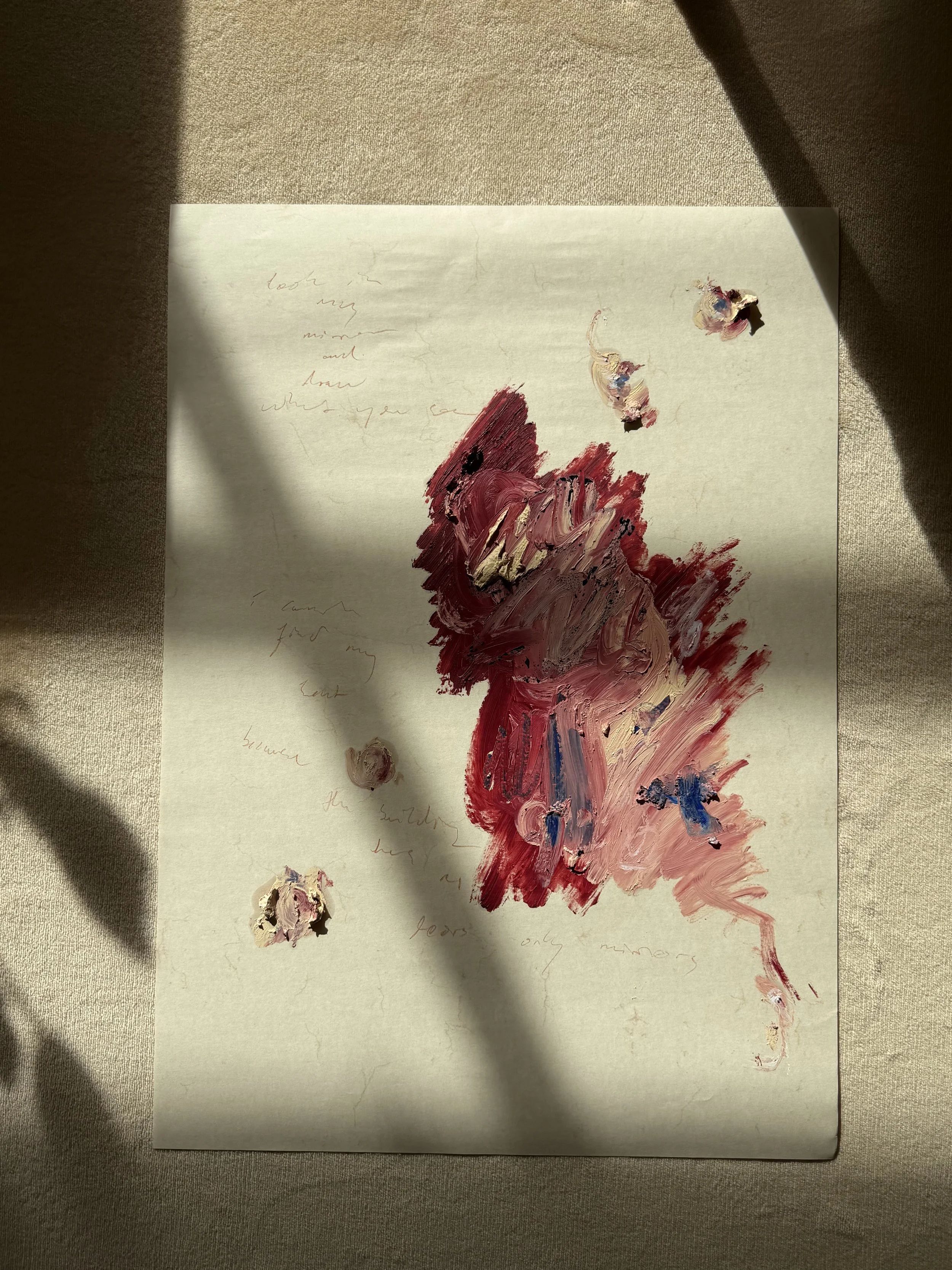 A piece of paper with an abstract painting made of thick brushstrokes in red, pink, and blue tones, with faint handwritten notes in the background.