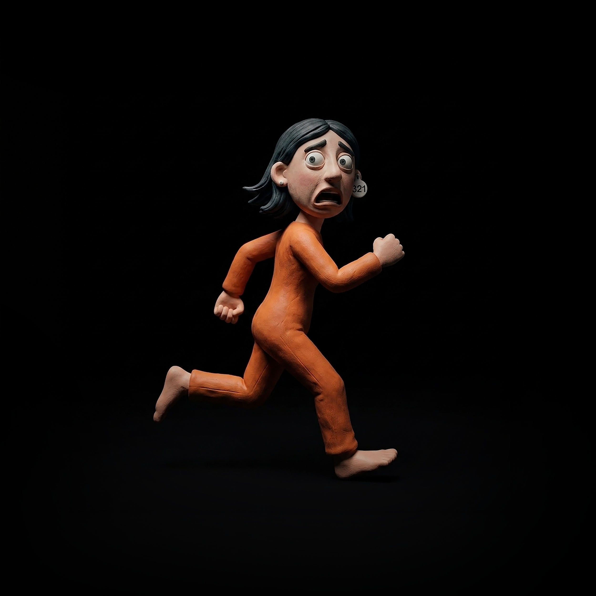 A figurine of an animated woman with dark hair, wearing an orange outfit, running or jogging against a black background.