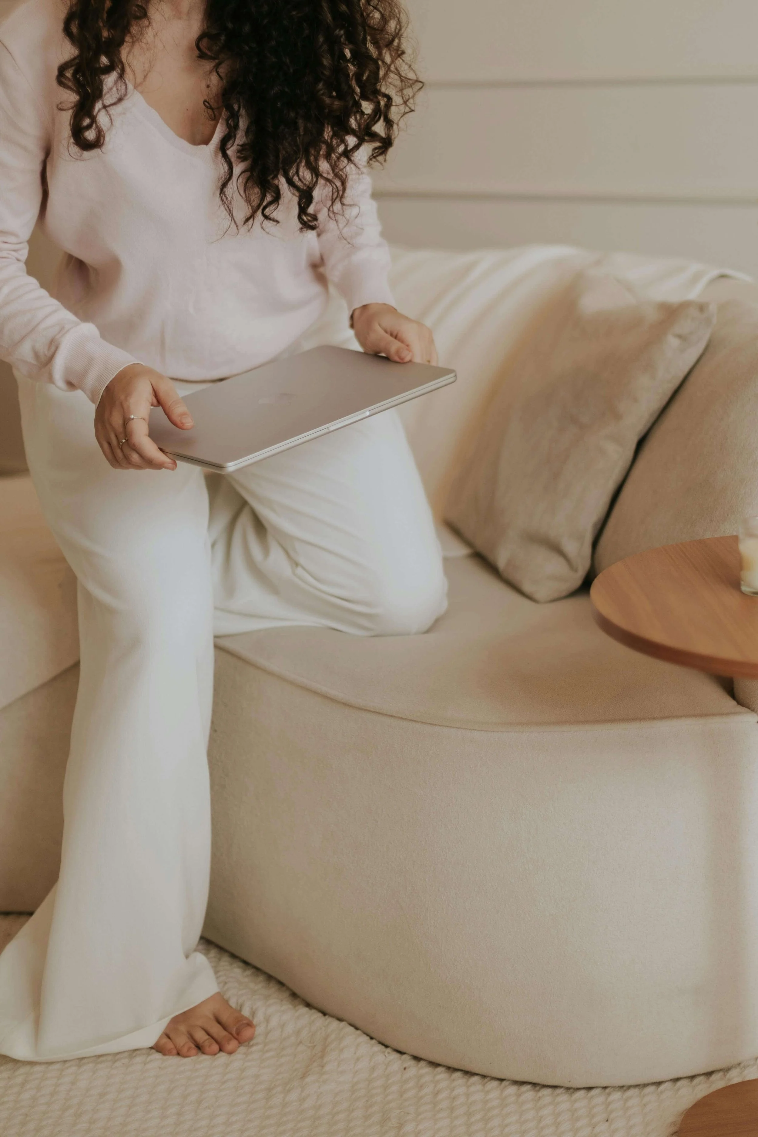 woman in pajamas researching postpartum care massachusetts
