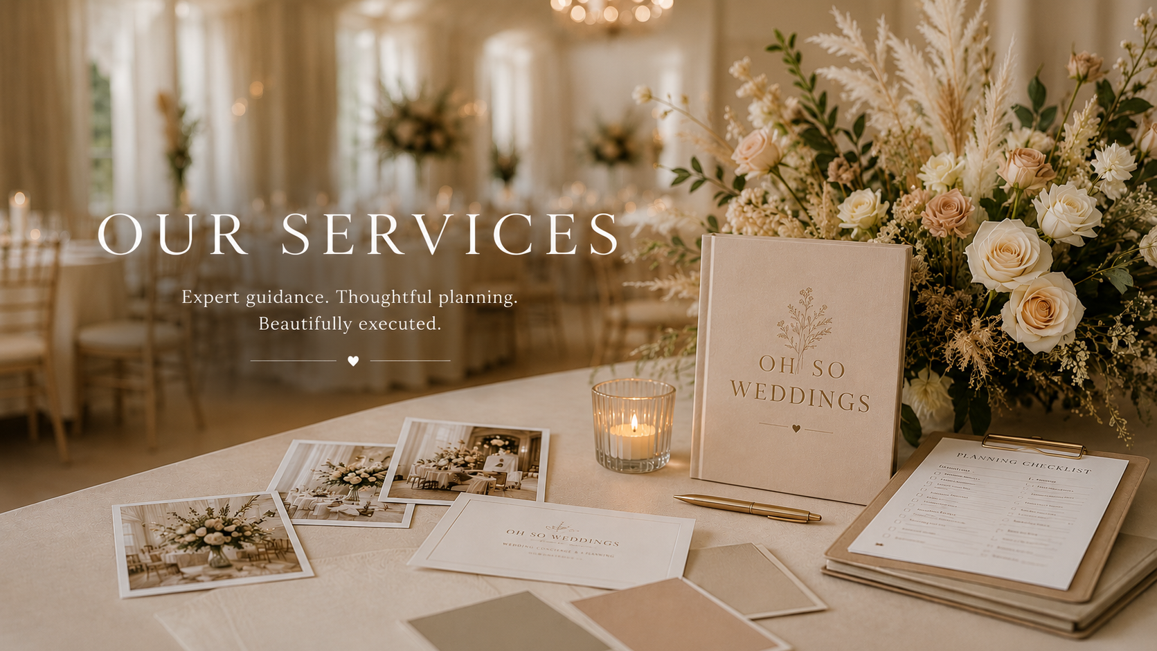 Wedding planning table with floral arrangements, photographs, candle, a book titled 'Oh So Weddings', and a clipboard with a checklist in a decorated reception hall.