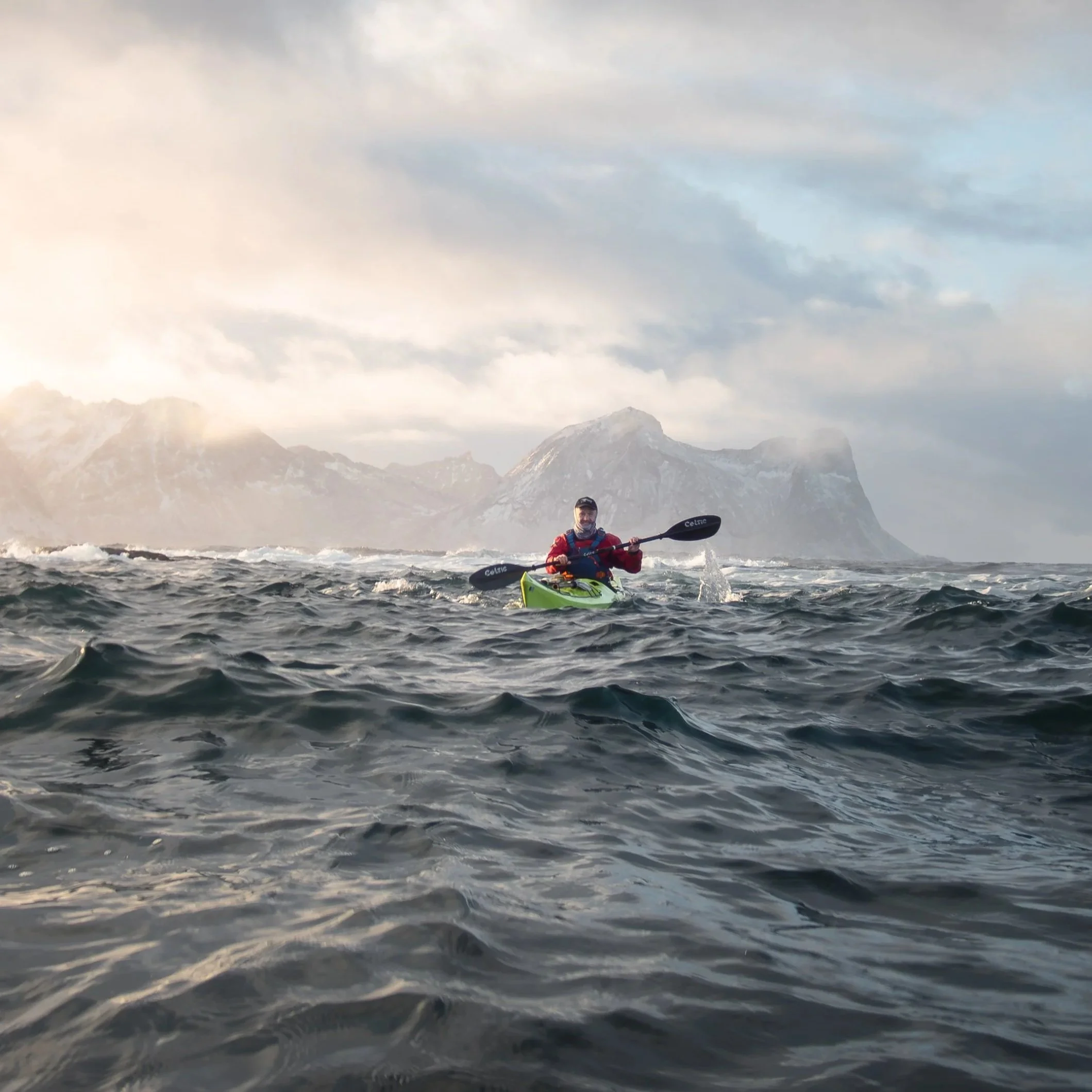 Kayaking on rough water in golden light