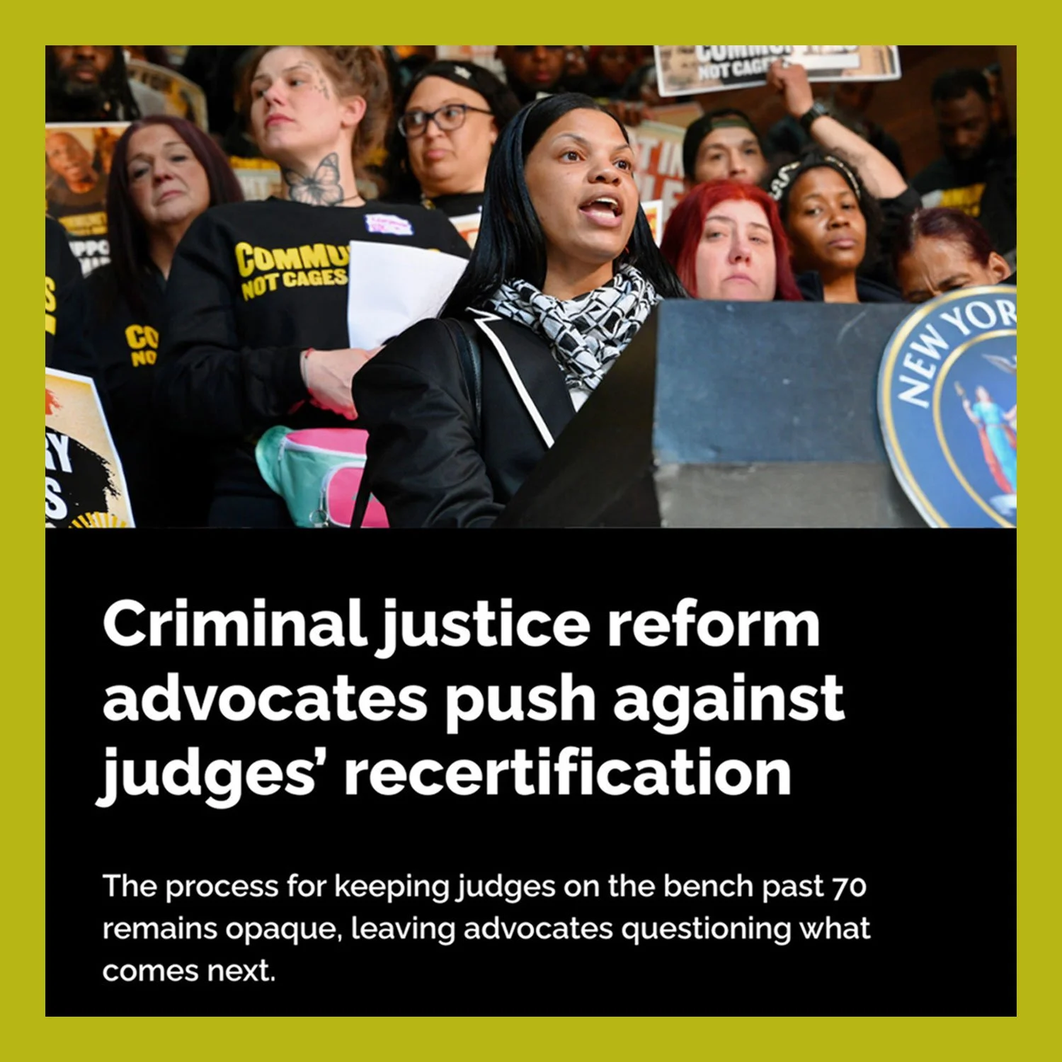 A woman speaking at a podium with a New York seal, surrounded by a diverse group of protesters holding signs. The headline reads: 'Criminal justice reform advocates push against judges' recertification'.