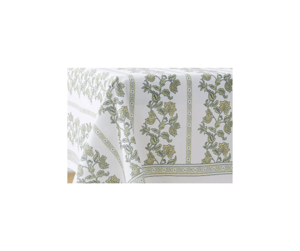 A white tablecloth with a gold floral pattern.