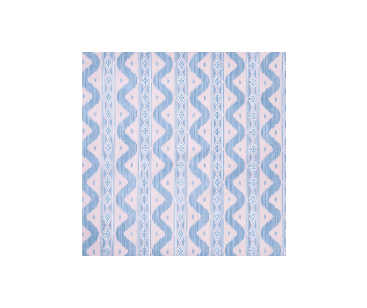 A fabric with a geometric pattern of light blue and beige, featuring wavy lines, diamonds, and small circle details.