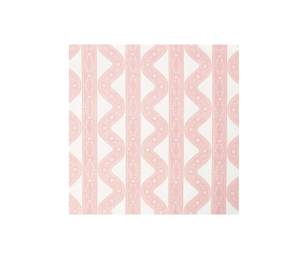 A textile with pink and white geometric and floral pattern.