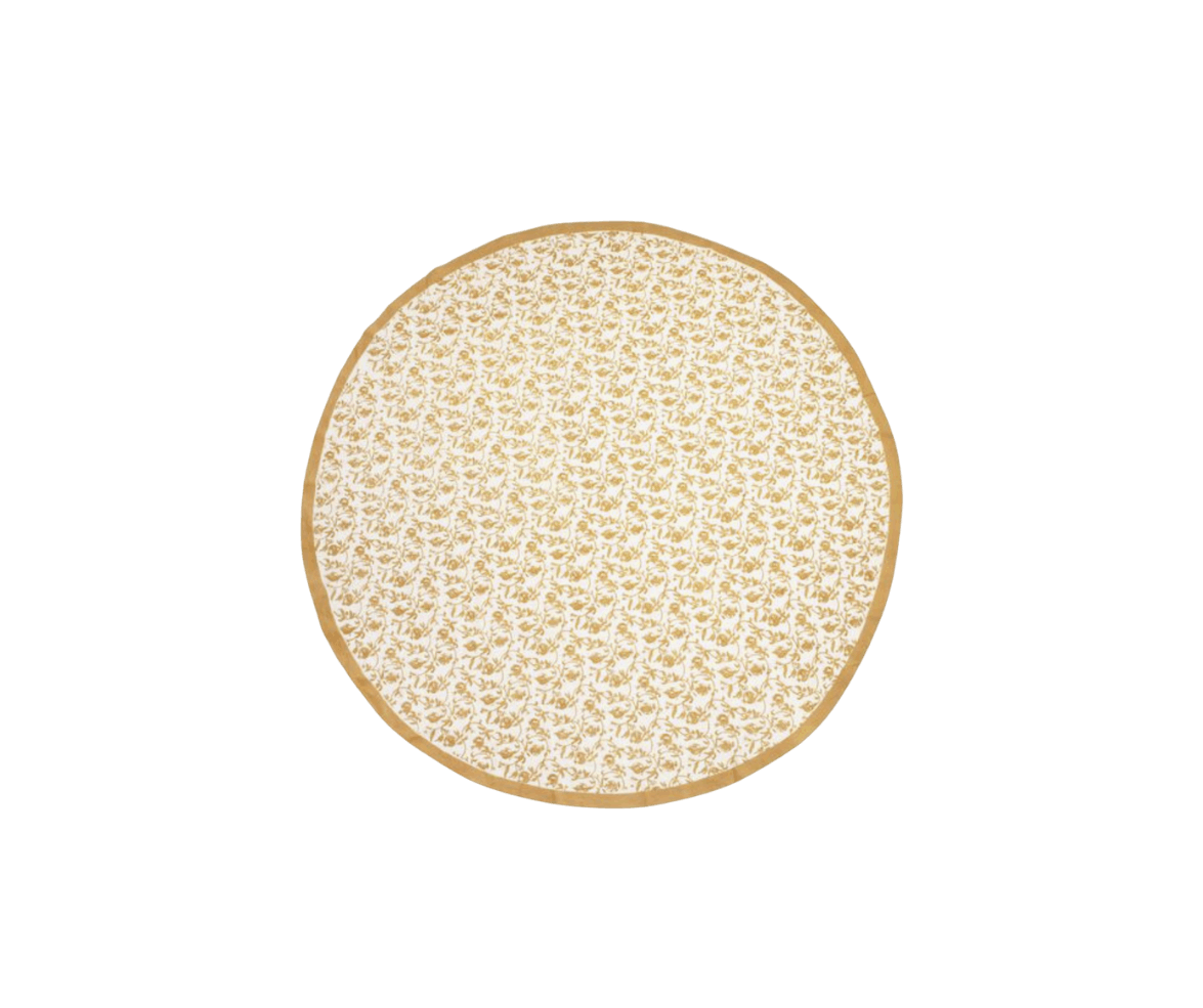A round cheese with a light beige rind and a patterned interior on a black background.