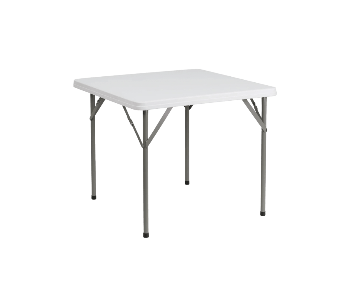 A white folding table with metal legs isolated on a black background.
