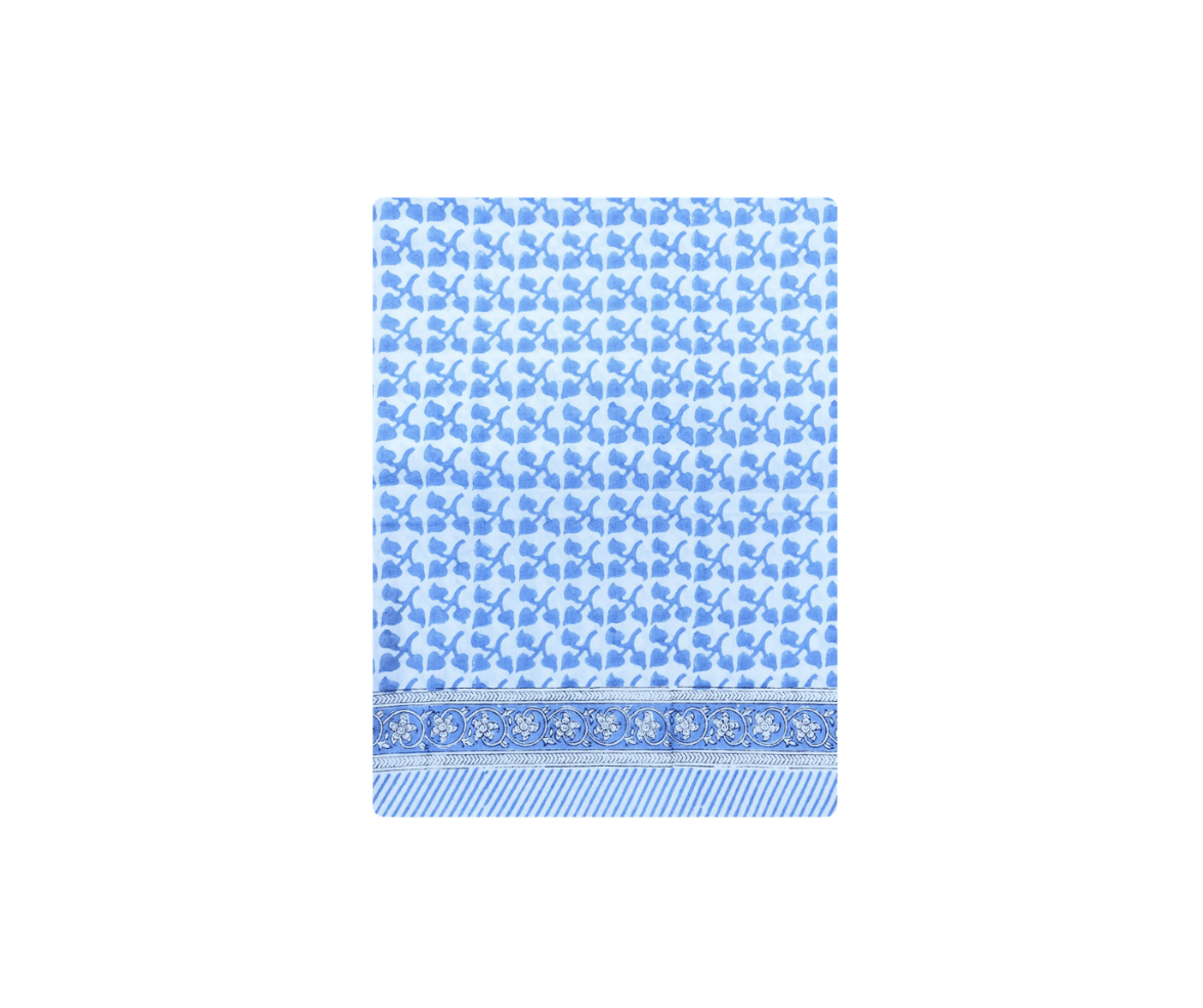 Blue patterned towel with floral border design.