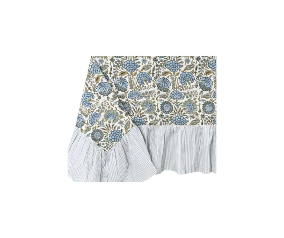 Tablecloth with floral pattern and pleated white fabric at the bottom