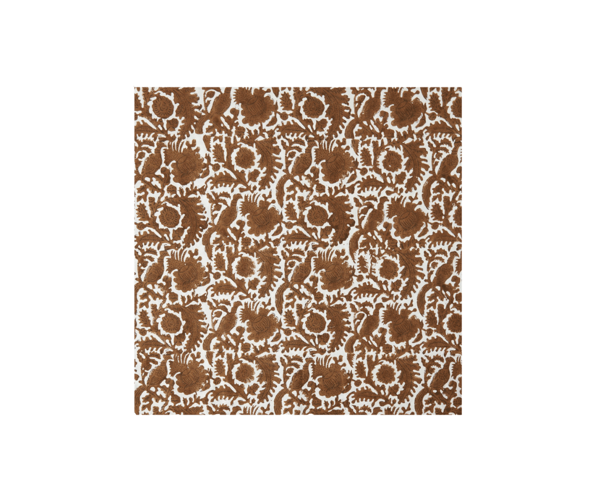 A brown and white patterned textile with intricate floral and leaf designs.