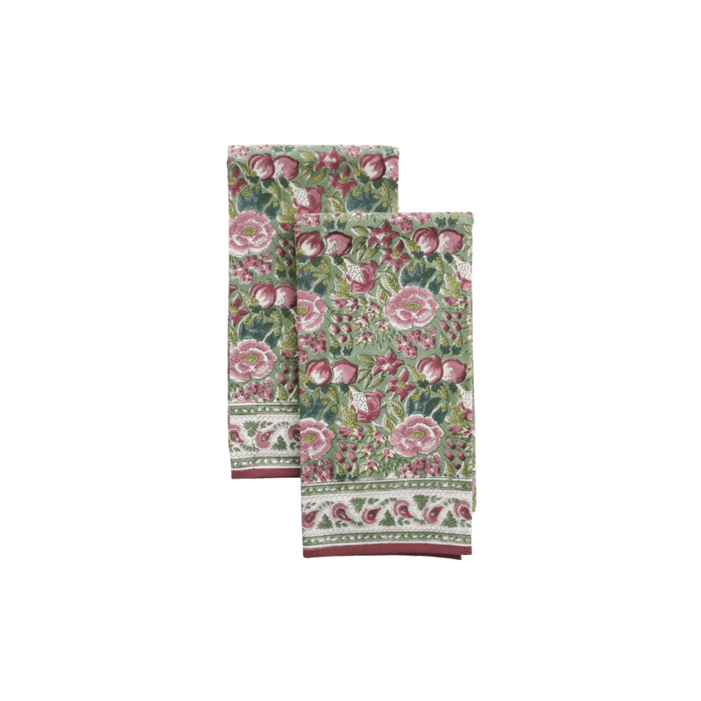 Two floral patterned cloths with pink, green, and white colors, featuring large flowers and decorative borders.