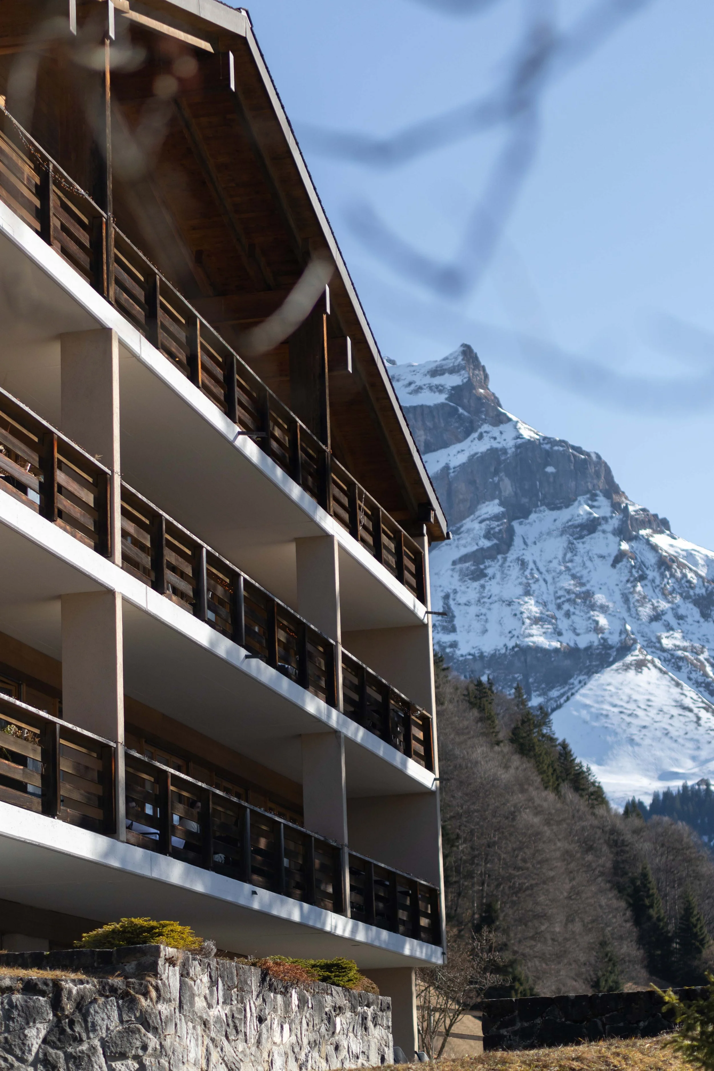 Private boutique hotel available for exclusive hire in Engelberg, Switzerland, with Swiss Alps backdrop