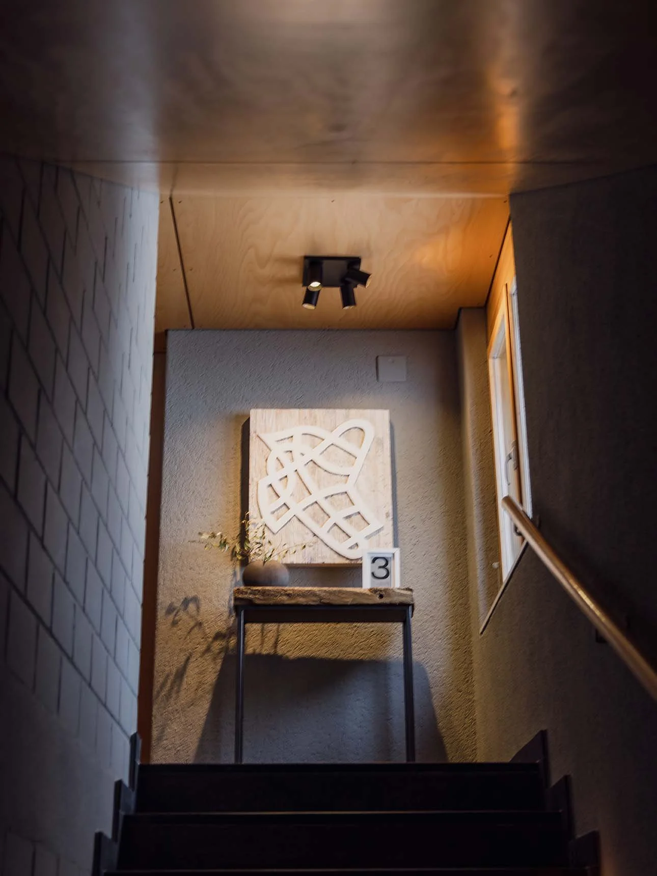 alpine-chalet-stairwell-artwork-room-number.jpg