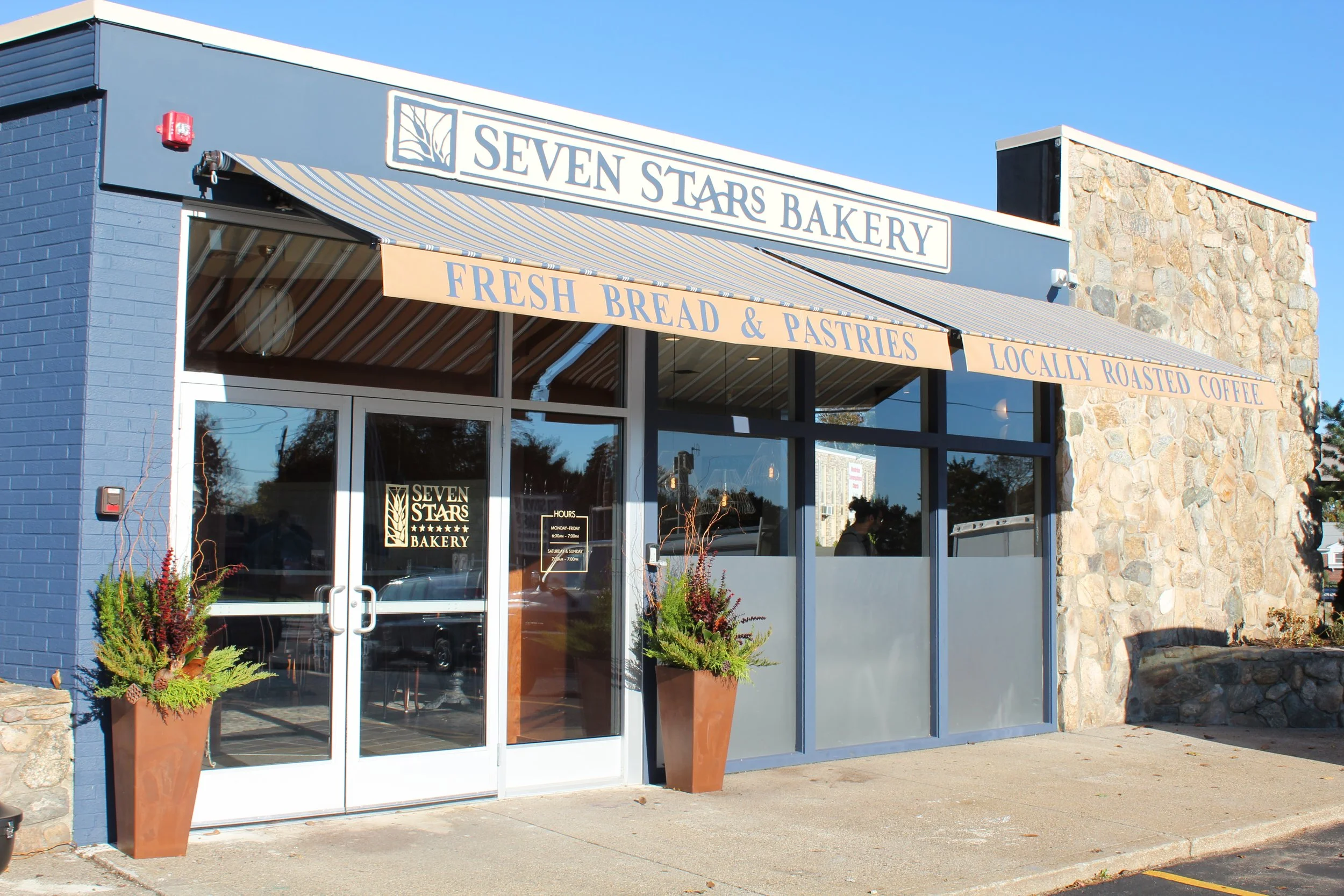 Seven Stars Bakery Reservoir Avenue Cranston storefront with “Fresh Bread & Pastries” and “Locally Roasted Coffee” signs.