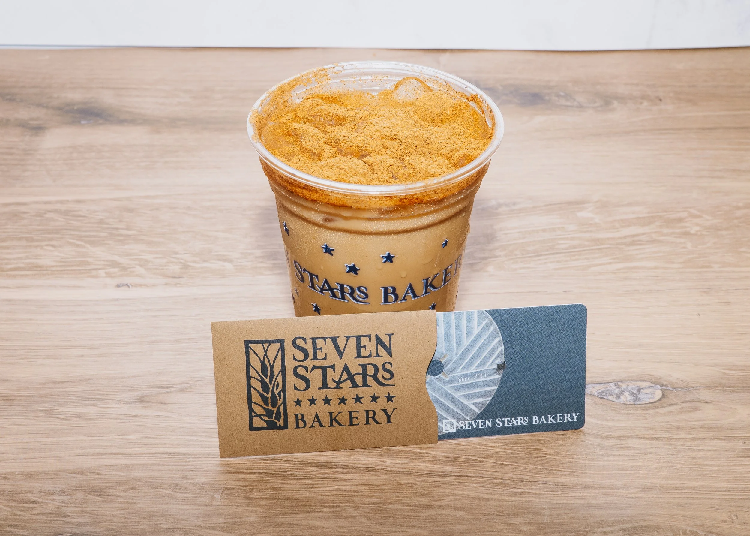 Iced pumpkin spice latte with cinnamon, a Seven Stars Bakery seasonal favorite along with a Seven Stars Bakery gift card.