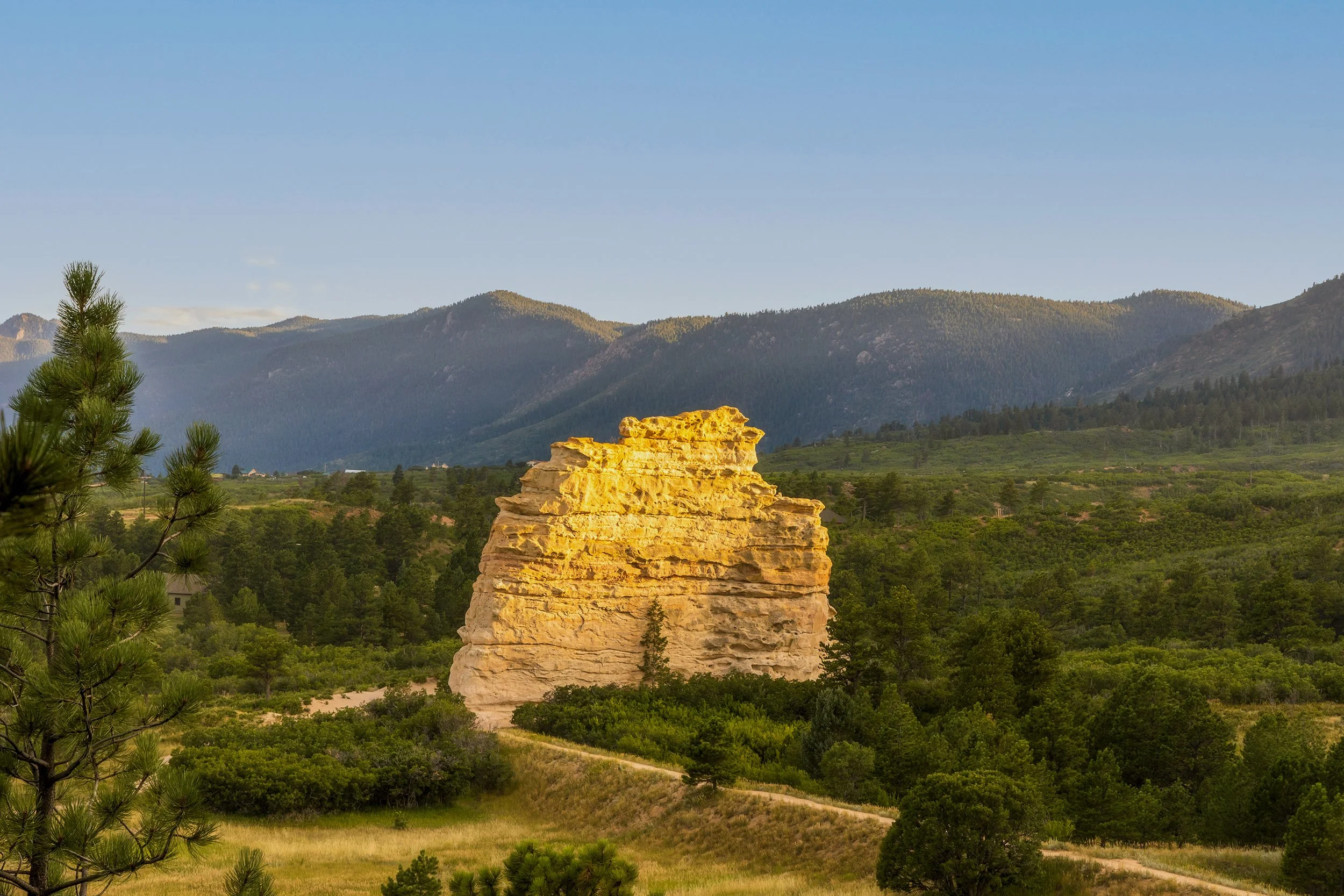 Monument Rock in Monument, CO. Our office sits on North Washington Street in downtown Monument, and we’ve spent more than two decades helping families across the Tri-Lakes region plan for retirement.