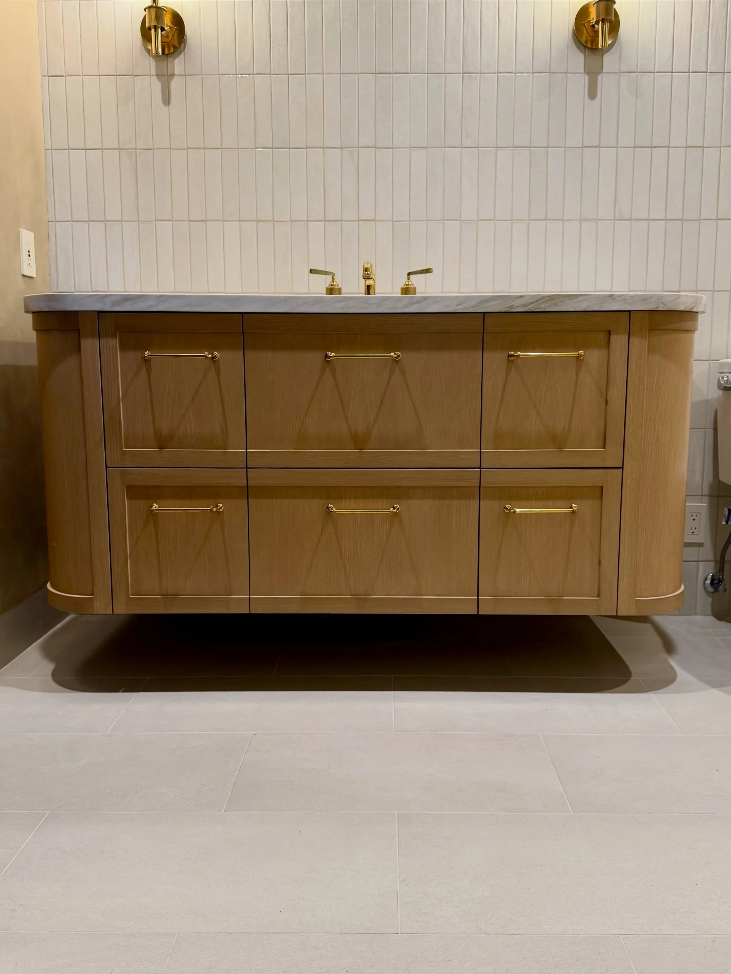 From concept to completion. Soft curves, warm wood tones, and polished brass details bring this custom floating vanity to life.

#CustomCabinetry #CustomVanity #InteriorDetails #InteriorDesign #HighEndCabinetry