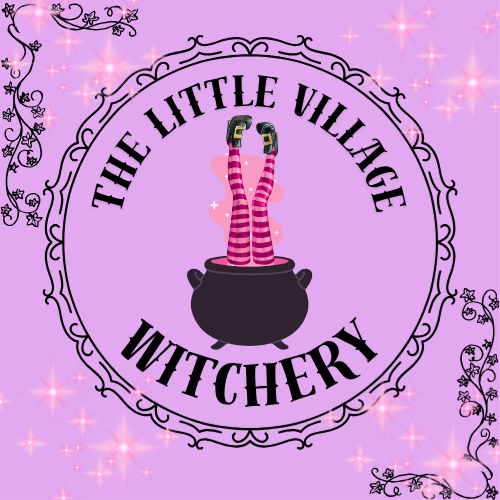 Purple background with stars and decorative border, featuring a black cauldron with pink and red-striped legs sticking out and the text 'The Little Village Witchery' in black around the cauldron.