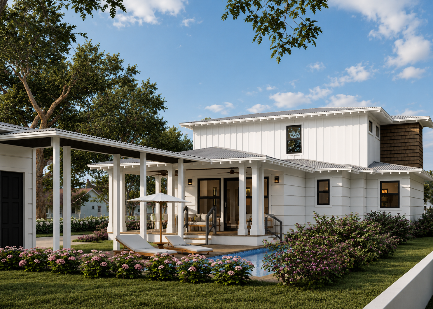 A modern white two-story house with black-framed windows, a covered porch with sitting area, and a backyard with a small swimming pool, lounge chairs, and blooming pink flowers, under a blue sky with some clouds.
