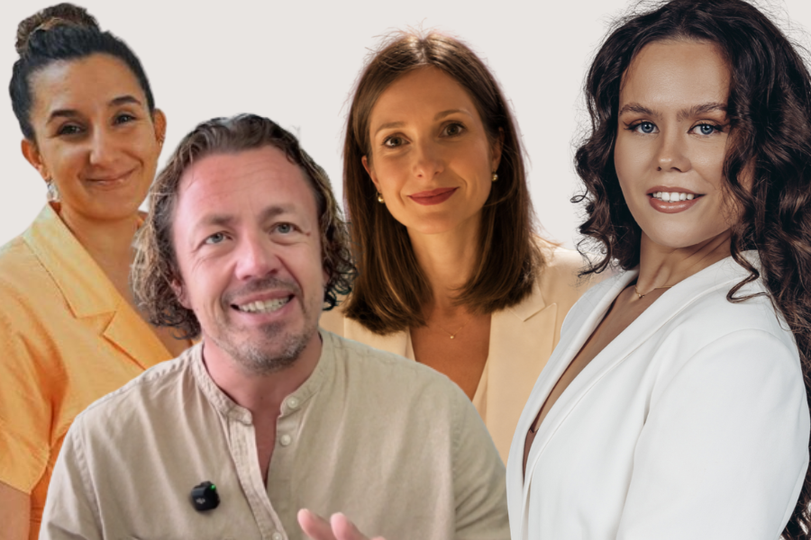 Four people, including two women with long hair, one woman with curly hair, and a man with short, wavy hair, smiling and posing for a portrait against a neutral background.
