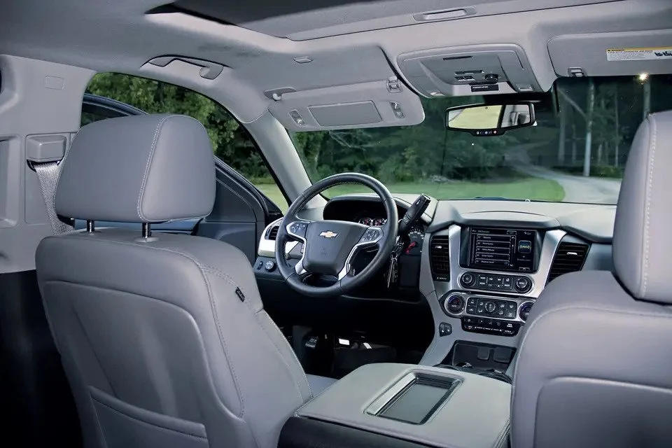 Interior view of a Chevrolet vehicle, showing the front seats, dashboard, steering wheel, and infotainment system.