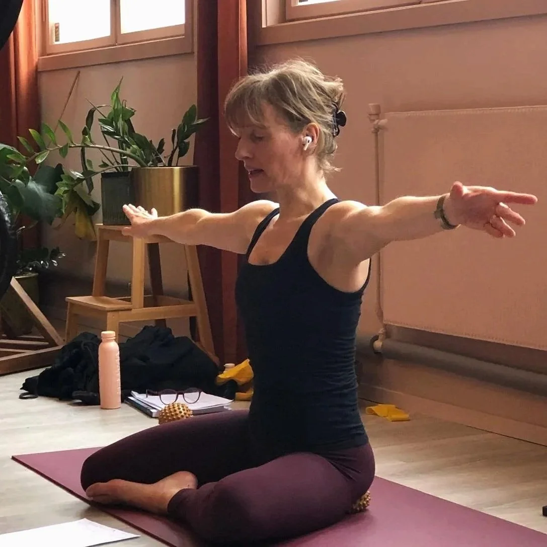 Stephanie practicing yoga indoors.