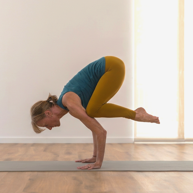 Stephanie performing a yoga pose.