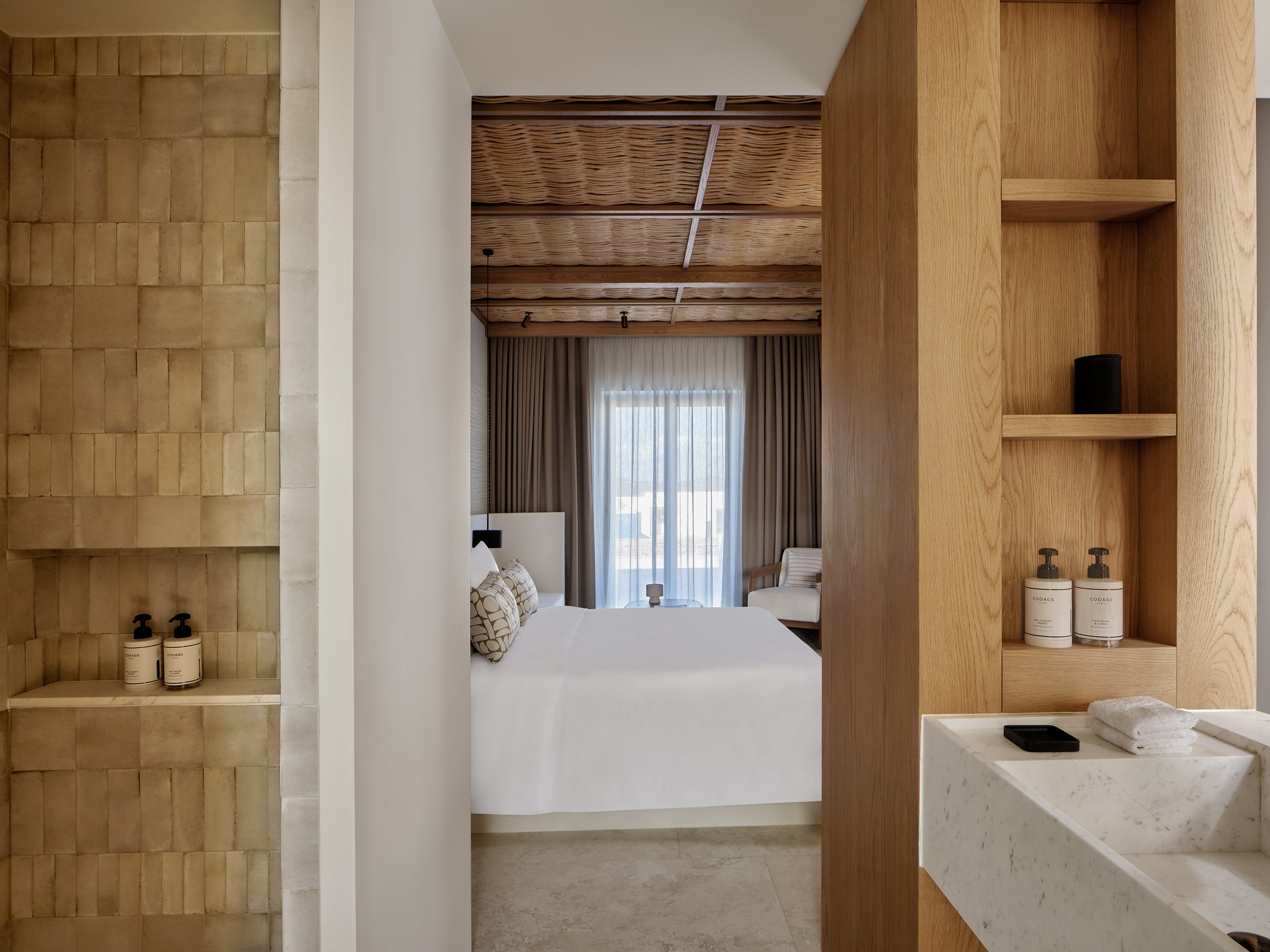 Junior-Suite-Bed-Bathroom-Overview.jpg