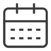 Icon of a calendar with grid lines indicating days.