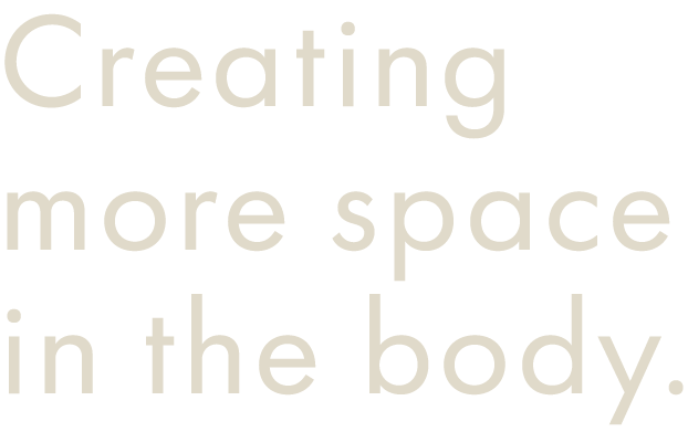 Text on black background that reads, "Creating more space in the body."