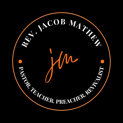 A circular logo with a black background and an orange border. Inside, it has white text saying 'Rev. Jacob Mathew' at the top and 'Pastor. Teacher. Preacher. REVIVALIST' at the bottom, with an orange handwritten initials 'jm' in the center.
