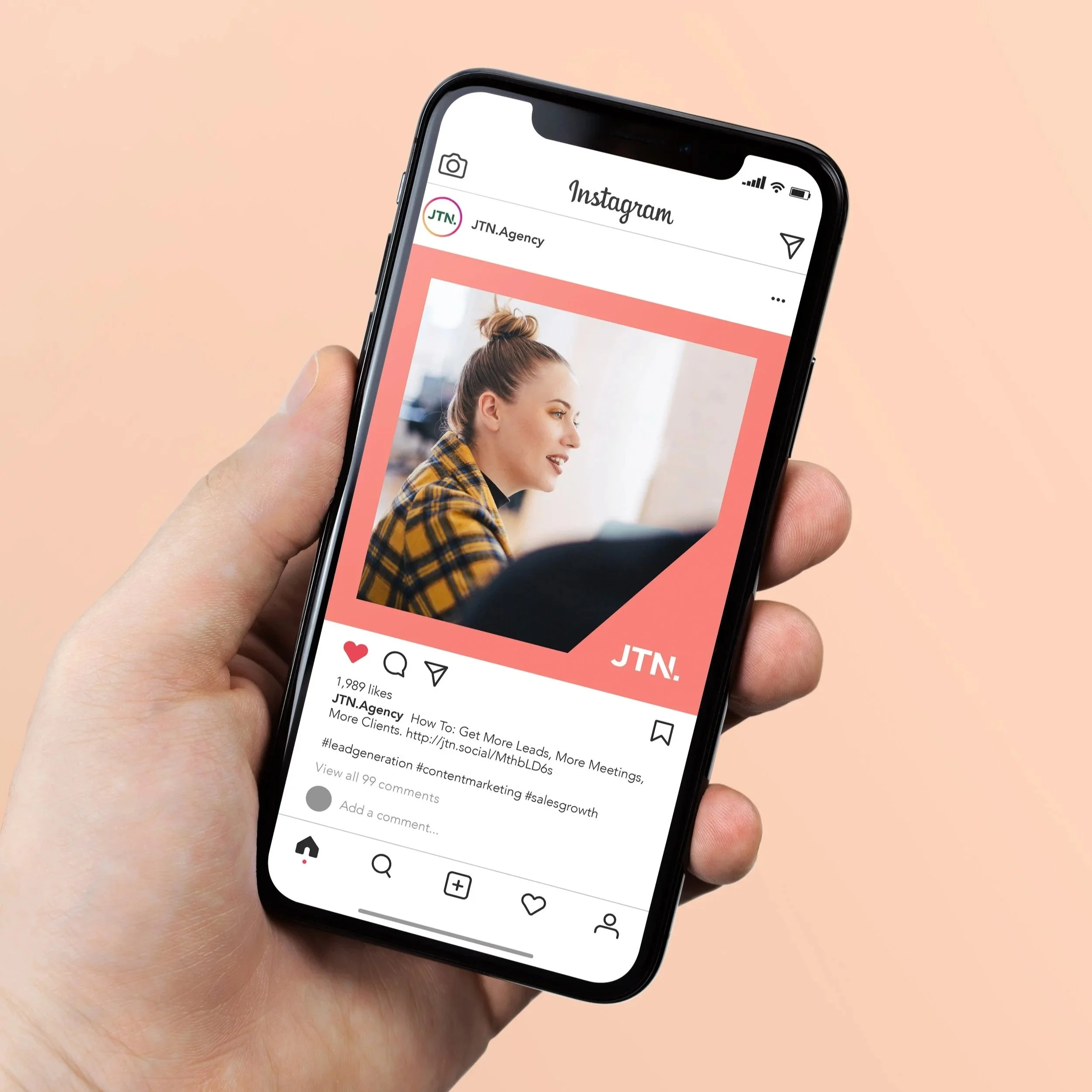 hand holding mobile phone showing instagram image
