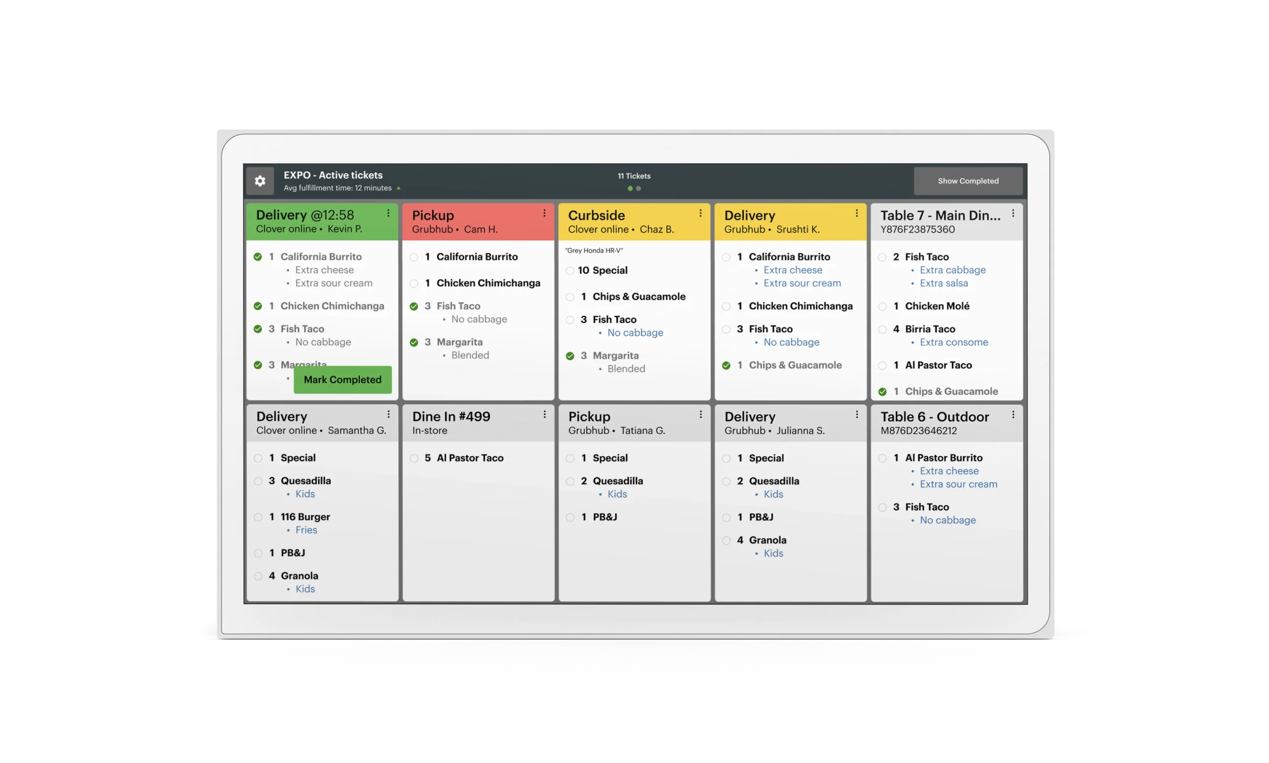 Digital food order management screen with various orders categorized by pickup, curbside, and delivery, showing items like burritos, fish tacos, and quesadillas.