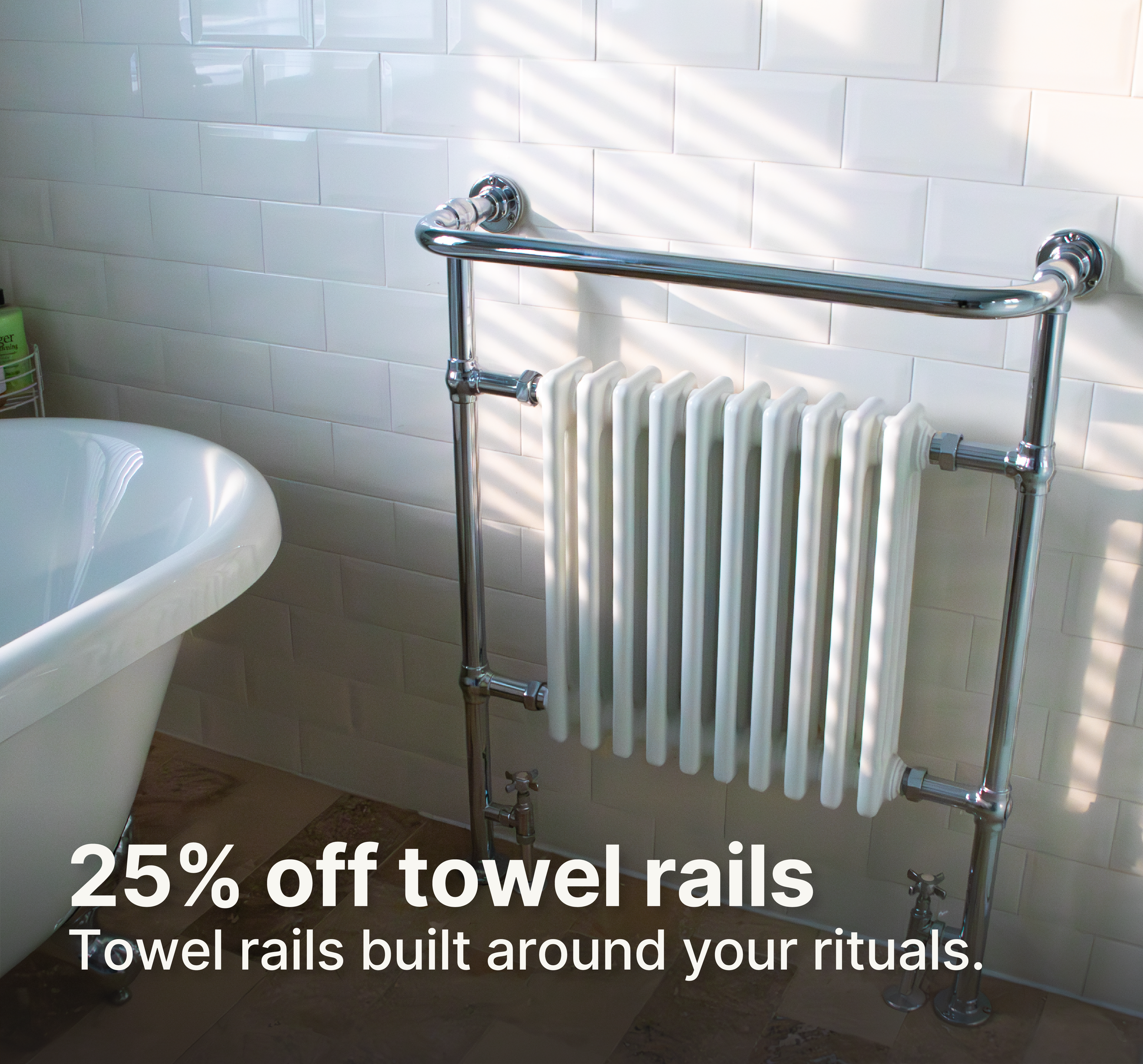 Bathroom wall with white subway tiles, towel rails, radiator, and partial view of a white sink