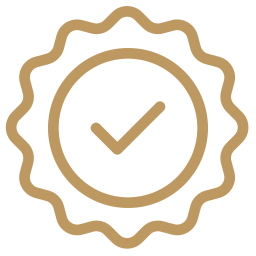 A gold-colored badge with a checkmark inside a circle, indicating approval or certification.