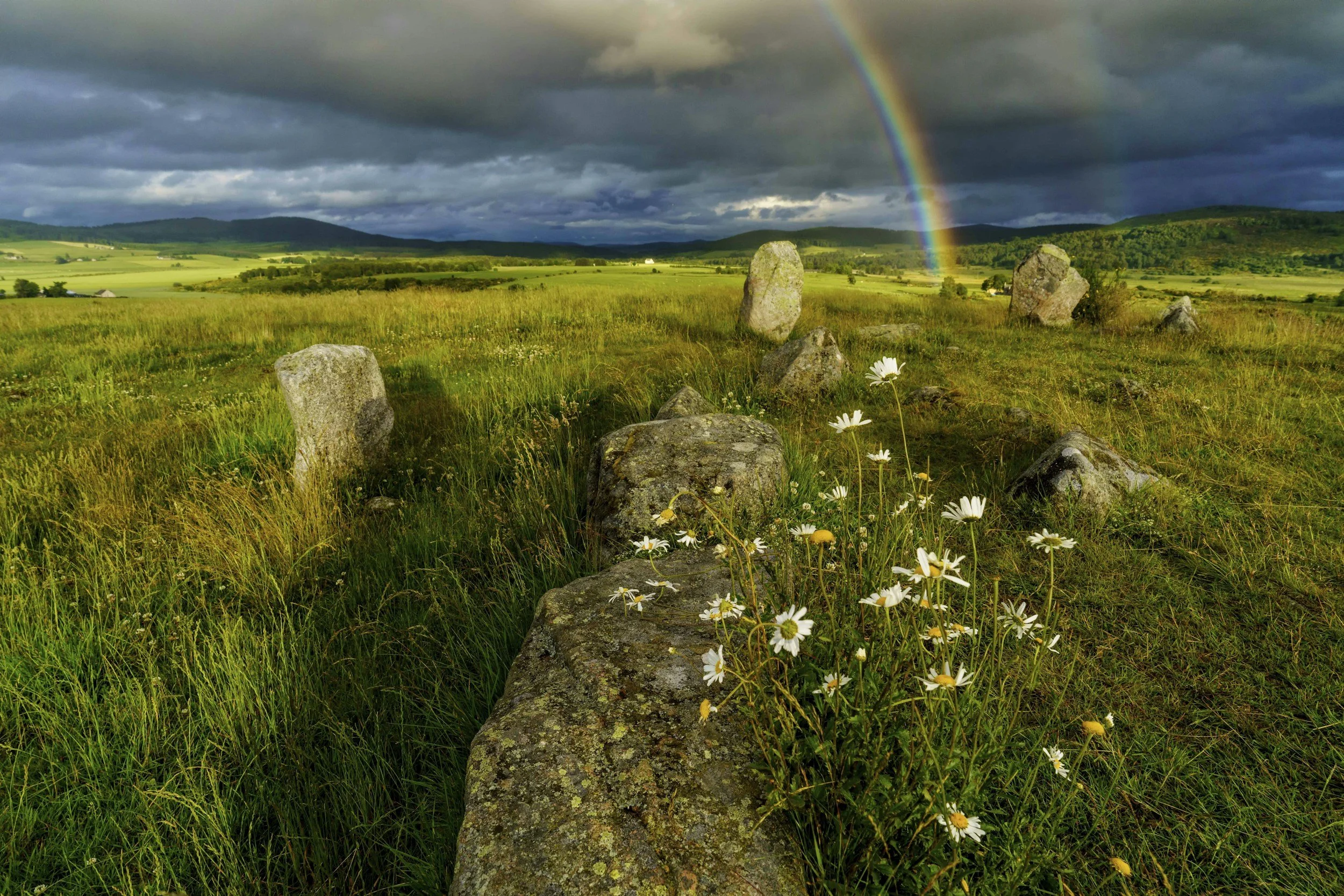 Photos of boulders and a rainbow in Scotland