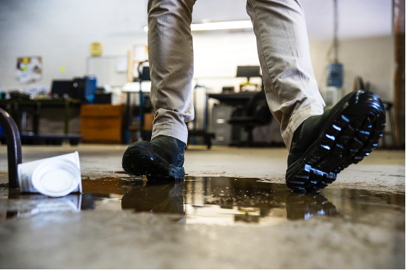 person slipping on puddle