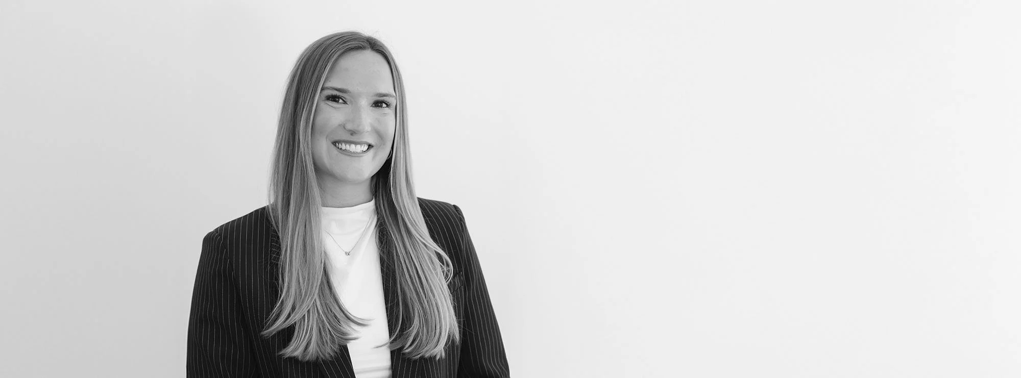 Black and white wide professional headshot of Jordan Loftin Wagoner, Associate at Loftin Holt Hall & Hargett LLP.