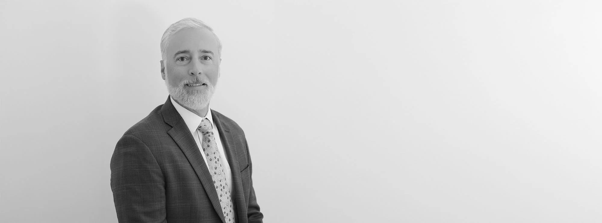 Wide black and white professional headshot of David W. Holt, Managing Partner at Loftin Holt Hall & Hargett LLP.
