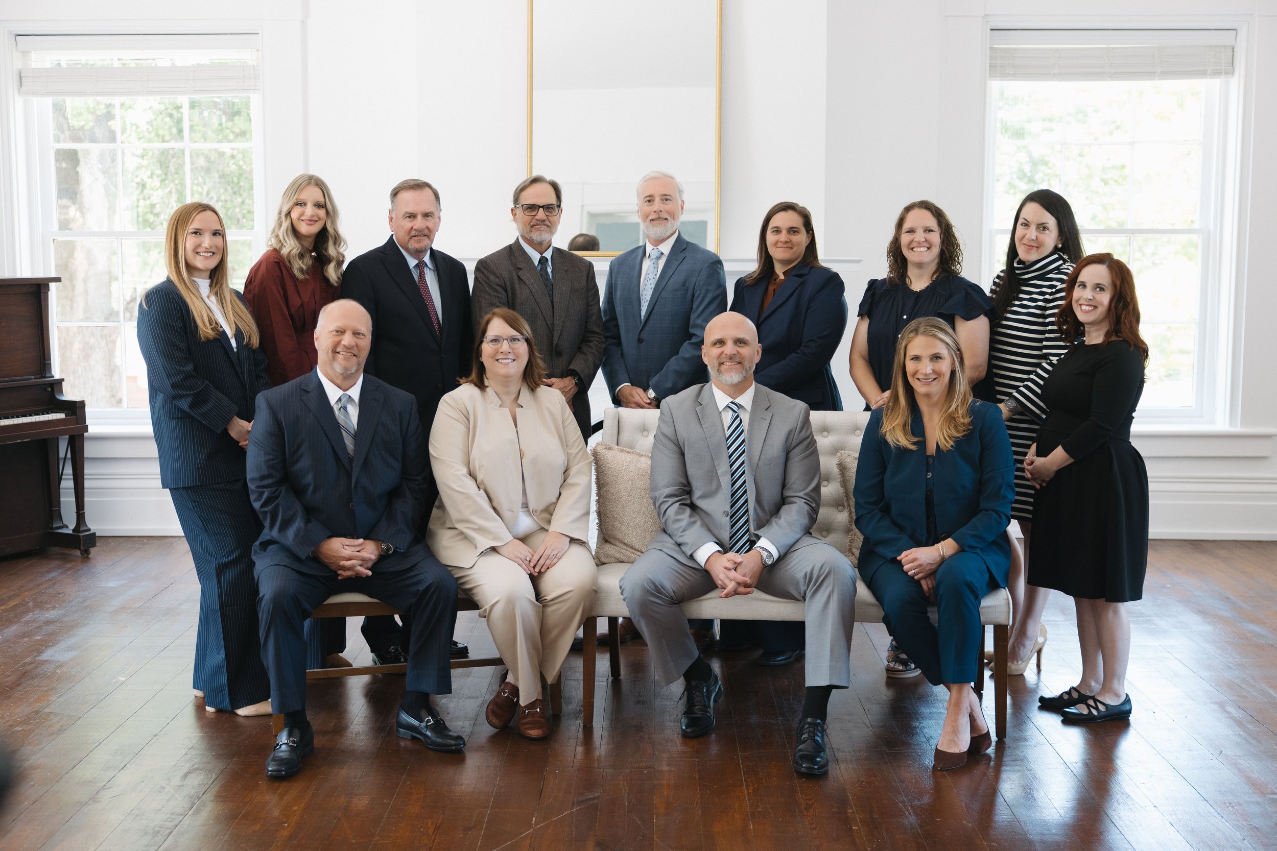 Attorneys and staff of Loftin Holt Hall & Hargett LLP gathered for a team portrait in the firm's office.