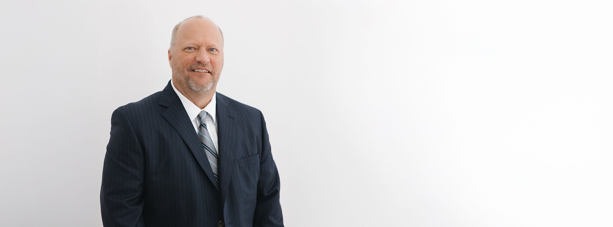 Wide professional headshot of Bartley Loftin, Founding Partner at Loftin Holt Hall & Hargett LLP.